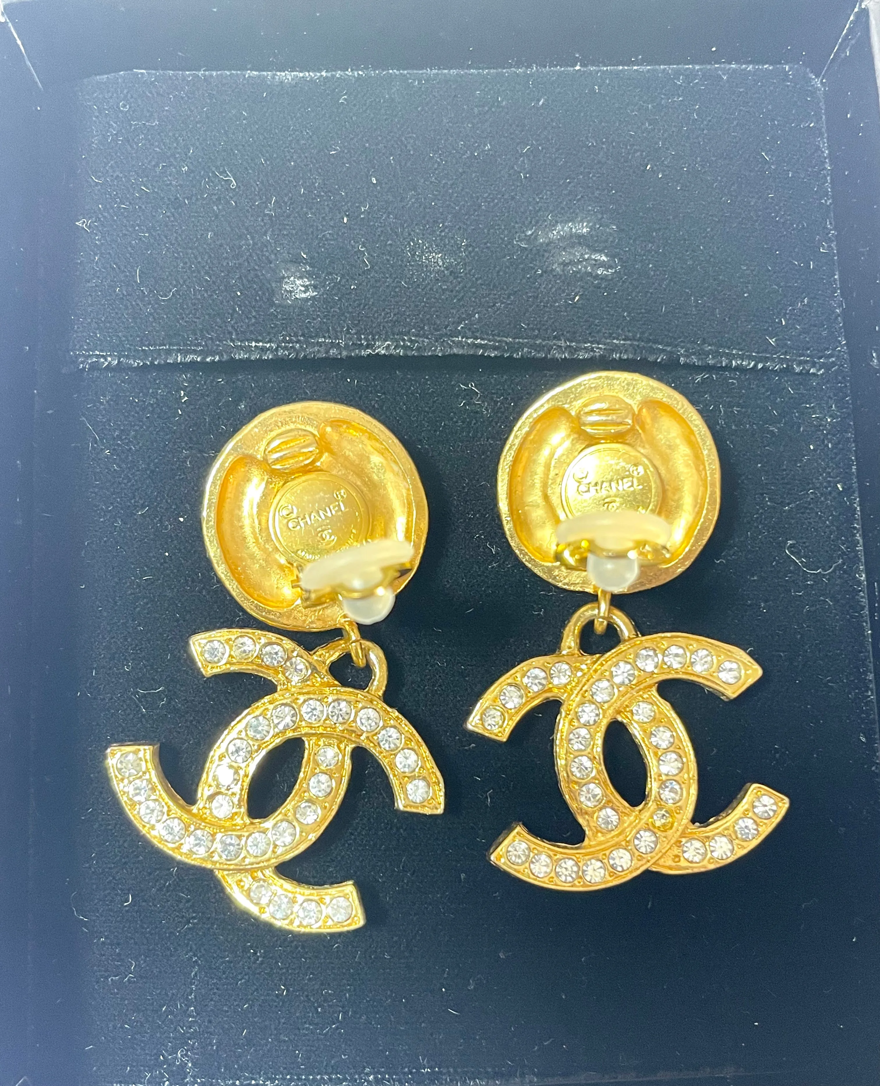 Vintage CHANEL dangle earrings with crystal CC motif and round logo embossed motif on top. Gorgeous vintage Chanel jewelry. 061214y1