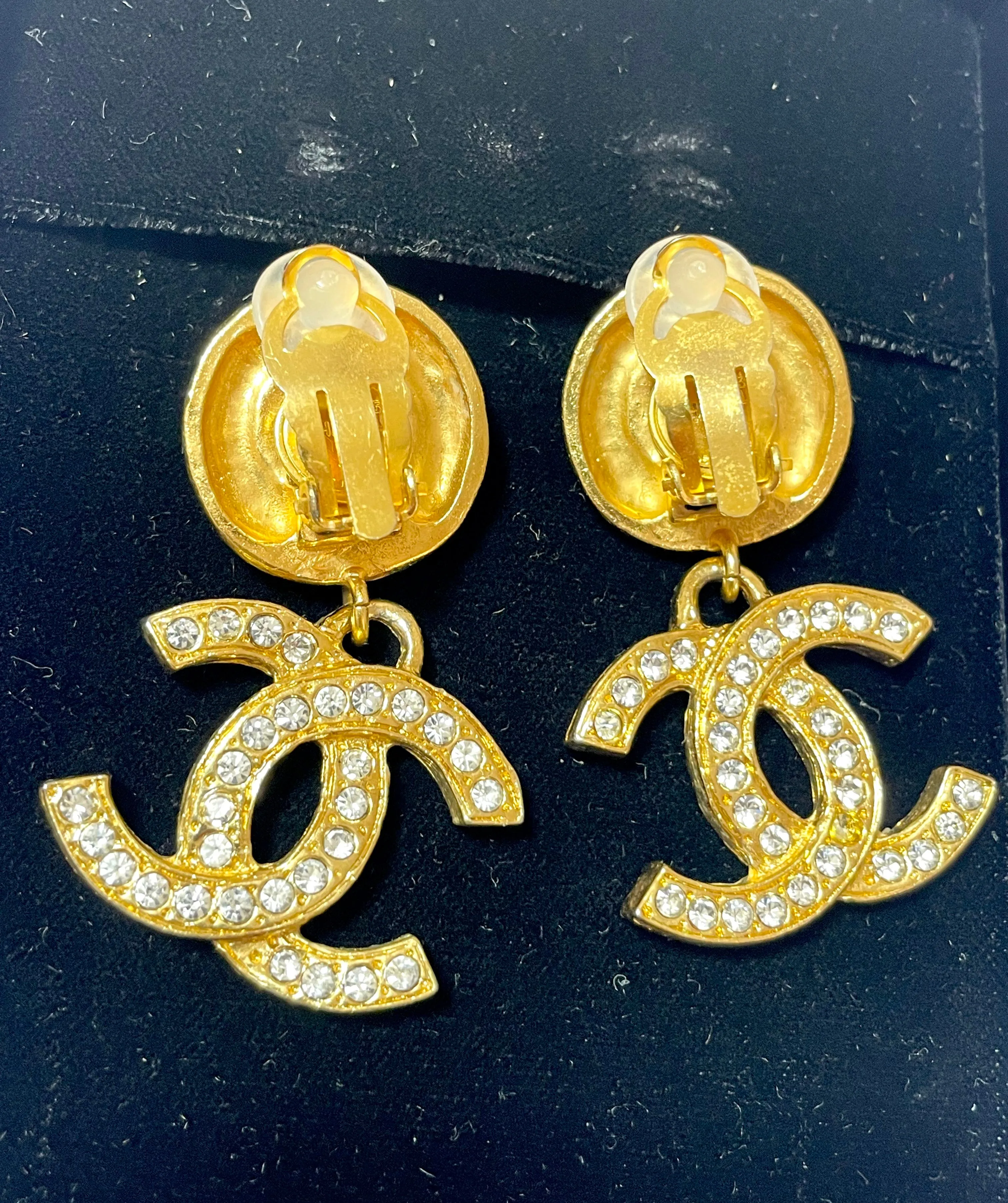 Vintage CHANEL dangle earrings with crystal CC motif and round logo embossed motif on top. Gorgeous vintage Chanel jewelry. 061214y1